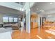 Open-concept living room and dining area with hardwood floors and plenty of natural light at 1950 Midnight Pass, Brownsburg, IN 46112