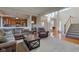 Spacious living room with open floor plan, stairs, and hardwood entry at 1950 Midnight Pass, Brownsburg, IN 46112