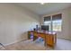 Bright office space featuring a wooden desk and natural light from the windows at 1950 Midnight Pass, Brownsburg, IN 46112