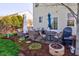 Cozy patio area with comfortable seating, a fire pit, and a grill, ideal for outdoor gatherings at 1950 Midnight Pass, Brownsburg, IN 46112