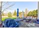 Backyard patio featuring comfortable seating, a grill, and a view of the lush greenery at 1950 Midnight Pass, Brownsburg, IN 46112