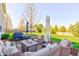Inviting patio with comfortable seating and a grill, perfect for outdoor gatherings and summer barbecues at 1950 Midnight Pass, Brownsburg, IN 46112