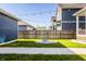 The backyard has a modern firepit area, manicured lawn, and a privacy fence perfect for outdoor entertaining at 2023 Alvord St, Indianapolis, IN 46202