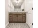 Well-lit bathroom with decorative tile flooring, a modern vanity with countertop, and combo shower and tub at 2023 Alvord St, Indianapolis, IN 46202