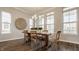 Bright dining room showcasing a wooden table, large windows, and stylish decor at 2023 Alvord St, Indianapolis, IN 46202