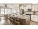 Modern kitchen with granite countertops, stainless steel appliances, and a breakfast bar at 2023 Alvord St, Indianapolis, IN 46202
