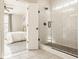 Stylish walk-in shower with white subway tiles and sleek black fixtures, adjacent to the bright main bedroom at 2023 Alvord St, Indianapolis, IN 46202