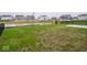 Spacious backyard with community view features a patio and lush lawn, perfect for activities at 20398 N Pacific Ave, Westfield, IN 46074