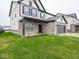Charming two-story home with welcoming front porch and green lawn at 20398 N Pacific Ave, Westfield, IN 46074