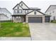 Charming two-story home features a 3-car garage and a welcoming brick facade at 20398 N Pacific Ave, Westfield, IN 46074