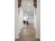 Hallway with decorative corbels, leading to open floorplan with a staircase at 20398 N Pacific Ave, Westfield, IN 46074
