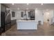Modern kitchen with white island, stainless steel appliances, and gray cabinetry at 20398 N Pacific Ave, Westfield, IN 46074