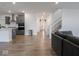 Open-concept living space featuring modern hardwood floors and white walls at 20398 N Pacific Ave, Westfield, IN 46074