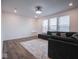 Spacious living room featuring a comfortable dark gray couch and decorative rug at 20398 N Pacific Ave, Westfield, IN 46074
