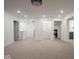 Spacious living room with neutral carpet, recessed lighting, and access to other rooms at 20398 N Pacific Ave, Westfield, IN 46074