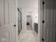 Modern shower with white marble-style tiles, black accents, and a built-in niche at 20398 N Pacific Ave, Westfield, IN 46074