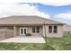 Spacious backyard features a concrete patio, wood privacy fence, and lawn, with a rear exterior view of the home at 2144 Connie Ct, Franklin, IN 46131