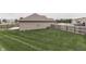 Well-maintained backyard with full lawn and wooden fence for privacy at 2144 Connie Ct, Franklin, IN 46131