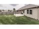 Spacious backyard features a concrete patio, wood privacy fence, lawn, and exterior of the home at 2144 Connie Ct, Franklin, IN 46131