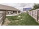 Wide backyard with wooden fence, lawn, and billboard sign behind home at 2144 Connie Ct, Franklin, IN 46131