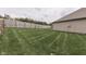 Spacious backyard with healthy green lawn and wood privacy fence at 2144 Connie Ct, Franklin, IN 46131