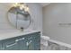 Well-appointed bathroom features a vanity with a quartz countertop, gold fixtures, and shiplap walls at 2144 Connie Ct, Franklin, IN 46131