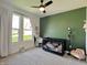 Bright Bedroom with decorative wall art, play kitchen, and a black crib at 2144 Connie Ct, Franklin, IN 46131