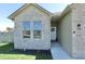 A bright entrance with a decorative wreath, windows, and manicured landscaping at 2144 Connie Ct, Franklin, IN 46131