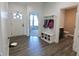 Inviting foyer with hardwood floors, coat rack, and easy access to other rooms at 2144 Connie Ct, Franklin, IN 46131