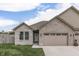 Charming brick home featuring a two-car garage, manicured lawn, and inviting entrance at 2144 Connie Ct, Franklin, IN 46131