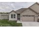 Inviting front exterior showcasing the brick facade, well-maintained lawn, and attached garage at 2144 Connie Ct, Franklin, IN 46131
