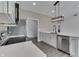 Bright kitchen featuring quartz countertops, stainless steel appliances, and a modern light fixture at 2144 Connie Ct, Franklin, IN 46131