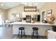 Open floorplan with a modern kitchen featuring stainless appliances, and a stylish island with bar stool seating at 2144 Connie Ct, Franklin, IN 46131