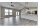 Open-concept living space with hardwood floors, modern lighting, and a view of the kitchen at 2144 Connie Ct, Franklin, IN 46131