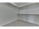 Empty walk-in closet features neutral carpeting, white walls and trim, and adjustable shelving at 2144 Connie Ct, Franklin, IN 46131