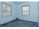 Bedroom with two windows offering natural light, and cozy carpeting at 2302 W 61St St, Indianapolis, IN 46228