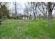 View of the home's exterior including the long driveway and two car garage at 2302 W 61St St, Indianapolis, IN 46228