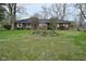 Charming brick ranch home with a well-maintained front yard and garden at 2302 W 61St St, Indianapolis, IN 46228