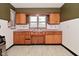 Eat-in kitchen featuring tile countertops, vintage cabinets and a double-window sink at 2302 W 61St St, Indianapolis, IN 46228