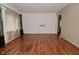 Spacious living room featuring hardwood floors, large windows, and light walls at 2302 W 61St St, Indianapolis, IN 46228