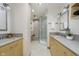 Bathroom featuring double sinks, light wood cabinets, and large glass door shower at 2305 Van Ness Pl, Indianapolis, IN 46240