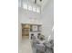 Open dining area with white brick wall, modern decor, and view of the kitchen at 2305 Van Ness Pl, Indianapolis, IN 46240