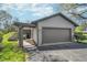 This lovely home features a two-car garage and a charming walkway to the front entrance at 2305 Van Ness Pl, Indianapolis, IN 46240