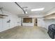 Spacious garage with ample storage, shelving, and overhead door with opener at 2305 Van Ness Pl, Indianapolis, IN 46240
