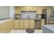 Kitchen featuring stainless steel appliances, wood cabinets, and modern countertops with stylish decor at 2305 Van Ness Pl, Indianapolis, IN 46240