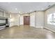 Large living room featuring built-in cabinets, ample lighting, and hardwood floors at 2305 Van Ness Pl, Indianapolis, IN 46240