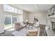 Well-lit living room features a fireplace and large sliding doors that provide access to the outdoors at 2305 Van Ness Pl, Indianapolis, IN 46240
