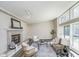 Bright living room featuring a fireplace, and large windows providing natural light at 2305 Van Ness Pl, Indianapolis, IN 46240