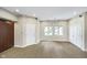 Spacious living area with light flooring, recessed lighting, and large windows at 2305 Van Ness Pl, Indianapolis, IN 46240