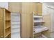 Custom pantry with shelving and pull out drawers provides maximized storage at 2305 Van Ness Pl, Indianapolis, IN 46240